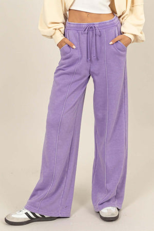 Purple drawstring high rise wide leg pants with pockets for a stylish and comfortable fit.