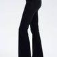 Side view of Basic Bae Pocketed Highly Stretchy Bootcut Jeans in black, showcasing a stylish fit and comfortable design.