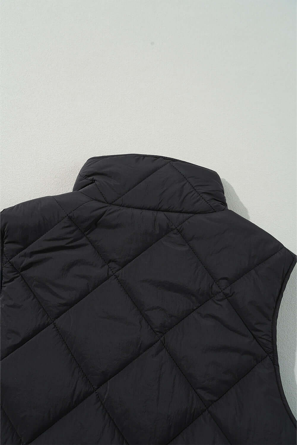 Black Bella Road Snap Down Texture Vest Coat with quilted design, perfect for fall fashion.