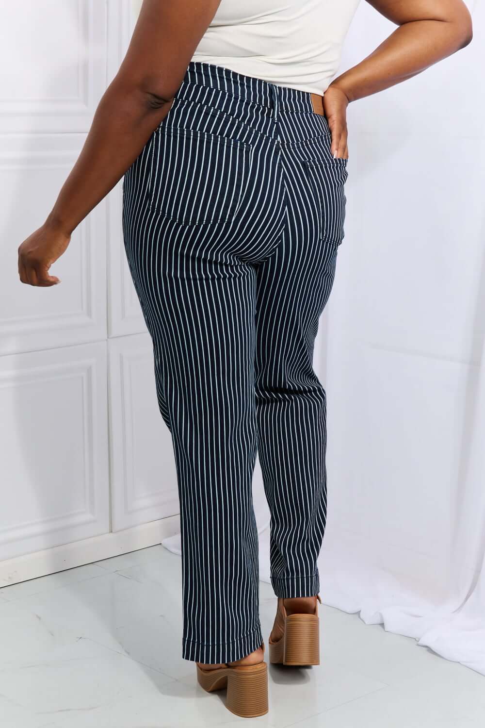 Cassidy full size high waisted tummy control striped straight jeans by Judy Blue Jeans, back view showing fit and design.