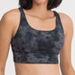 Stylish Millennia crisscross scoop neck tank in dark tie-dye, perfect for workouts with comfort and breathability.