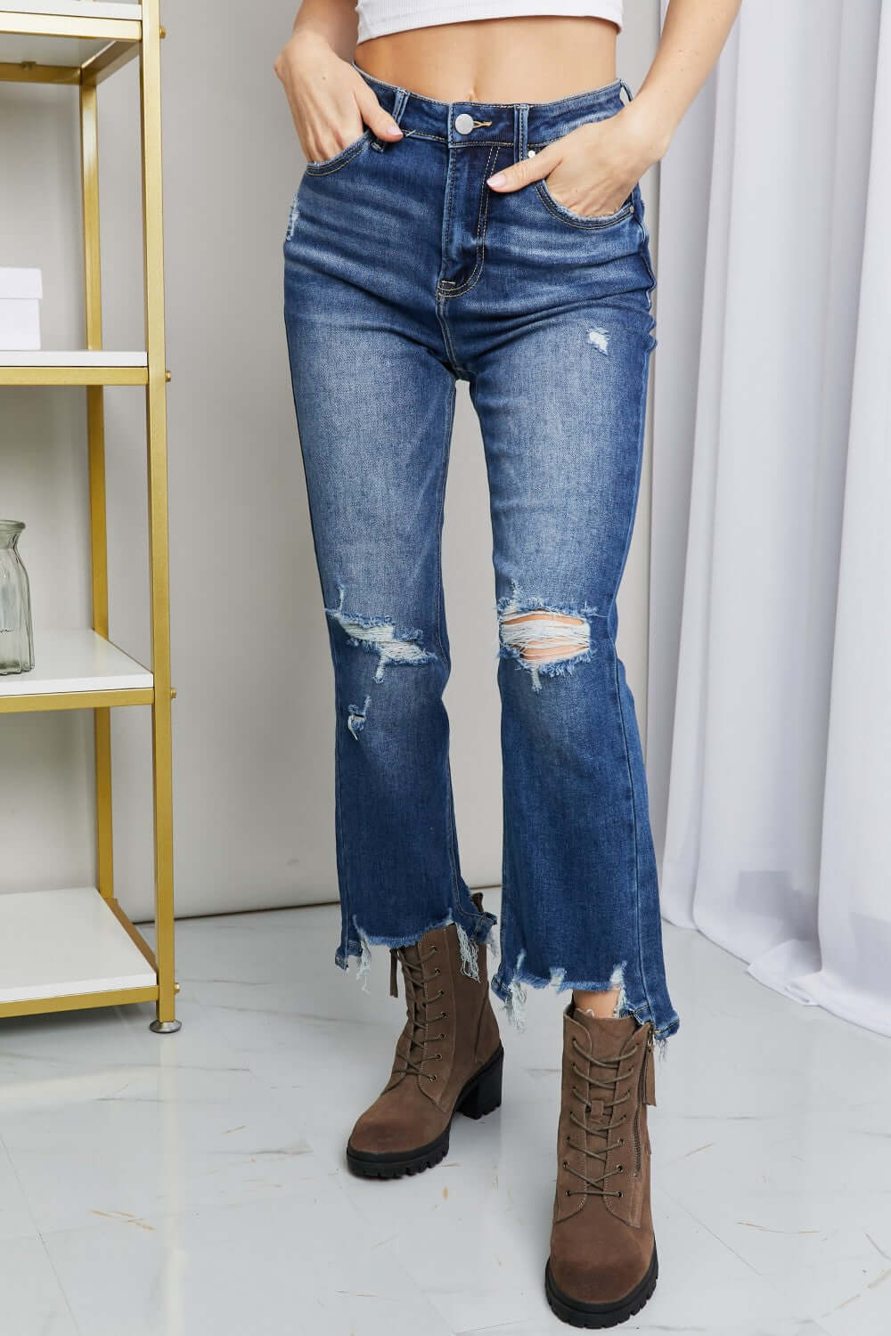 Frayed Hem Distressed Cropped Risen Jeans with pockets, styled with brown boots, perfect casual look.