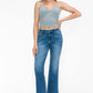 Model wearing bytos Cat's Whiskers Mid Rise Ankle Jeans with a gray crop top, showcasing a trendy and chic outfit.