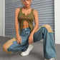 Woman wearing Bella Road Distressed Wide Leg Jeans with Pockets, displaying edgy style with ripped details and relaxed fit.