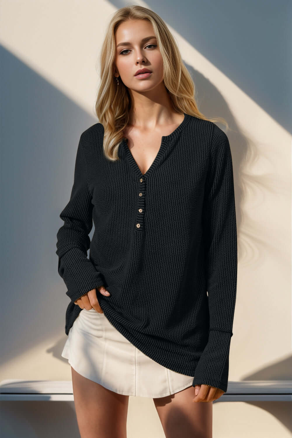 Woman wearing Double Take full size notched thumbhole long sleeve t-shirt in black with moderate stretch and buttoned neckline.