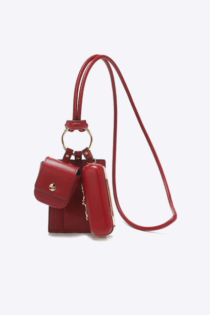 Nicole Lee USA vegan leather 3-piece lanyard set in red, featuring a mini bag and AirPods case. Stylish and functional design.