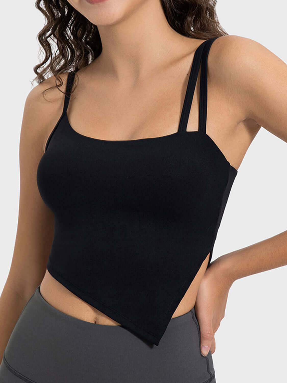 Millennia Slit Asymmetrical Neck Active Cami in black, featuring stylish slit and adjustable straps for workouts.