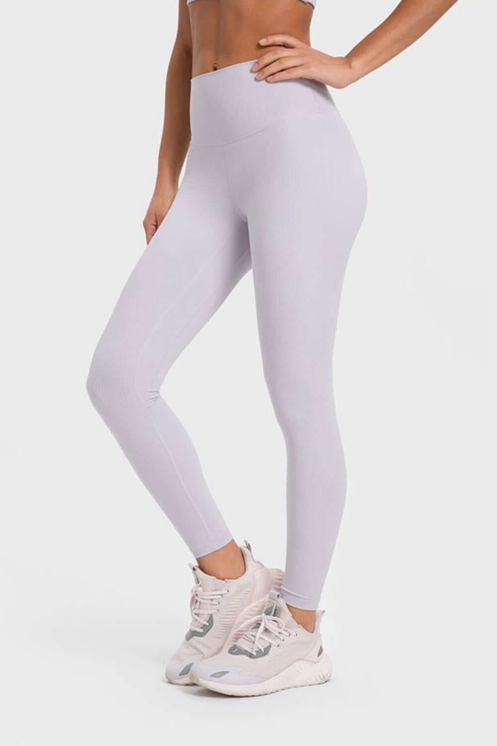 Light gray Millennia yoga leggings with wide waistband, perfect for comfort and flexibility during workouts.