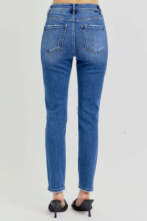 Back view of RISEN full size high rise ankle skinny knee distressed jeans with back pockets, showing a trendy and flattering fit