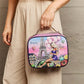 Woman holding Nicole Lee USA printed handbag with Parisian design and Eiffel Tower illustration