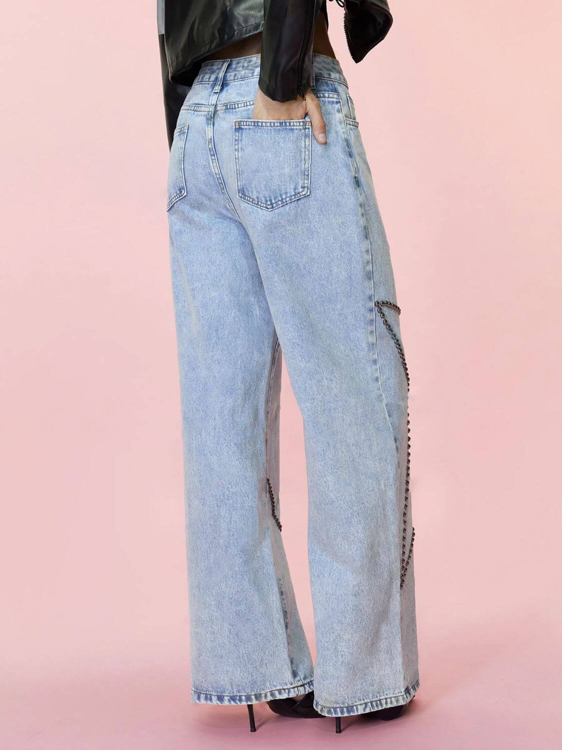 Bella Road Studded Star Straight Jeans with pockets in light blue denim, featuring stylish studded details on a model from the back view.