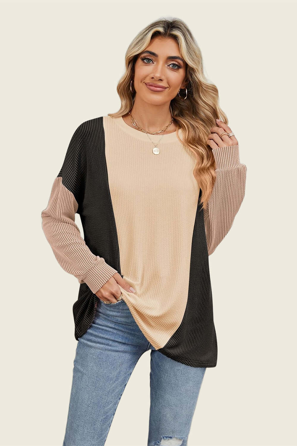 Woman wearing Double Take Texture Contrast Round Neck Long Sleeve T-Shirt in trendy color combo