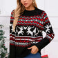 Woman wearing a festive Angel Wings Reindeer Sweater with a round neck and long sleeves, perfect for holiday cheer.