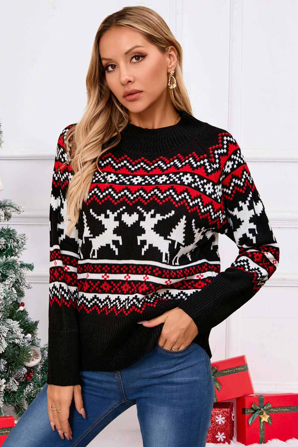 Woman wearing a festive Angel Wings Reindeer Sweater with a round neck and long sleeves, perfect for holiday cheer.