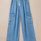 Bella Road light wash wide leg jeans with drawstring and cargo pockets, perfect for casual outings.