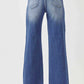 Back view of Risen Jeans high waist raw hem wide leg jeans showcasing trendy and chic denim style with flattering fit.