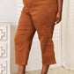 Woman wearing Judy Blue Jeans tummy control wide cropped pants in brown, paired with clear heels, showing the front and side view.