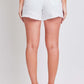 Back view of YMI Jeans distressed frayed hem denim shorts in white, showcasing edgy and casual summer style.