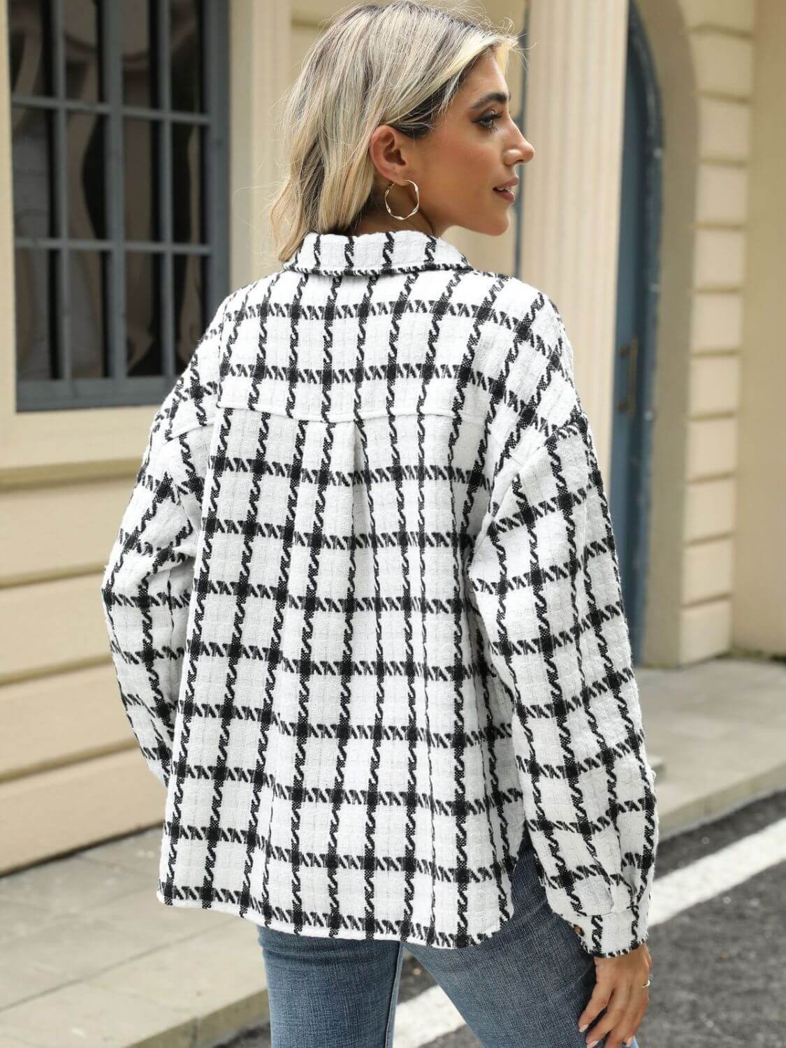 Woman wearing Bella Road plaid collared long sleeve jacket standing outdoors