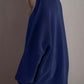 Woman wearing Double Take Side Slit Round Neck Long Sleeve Sweater in navy blue from behind.