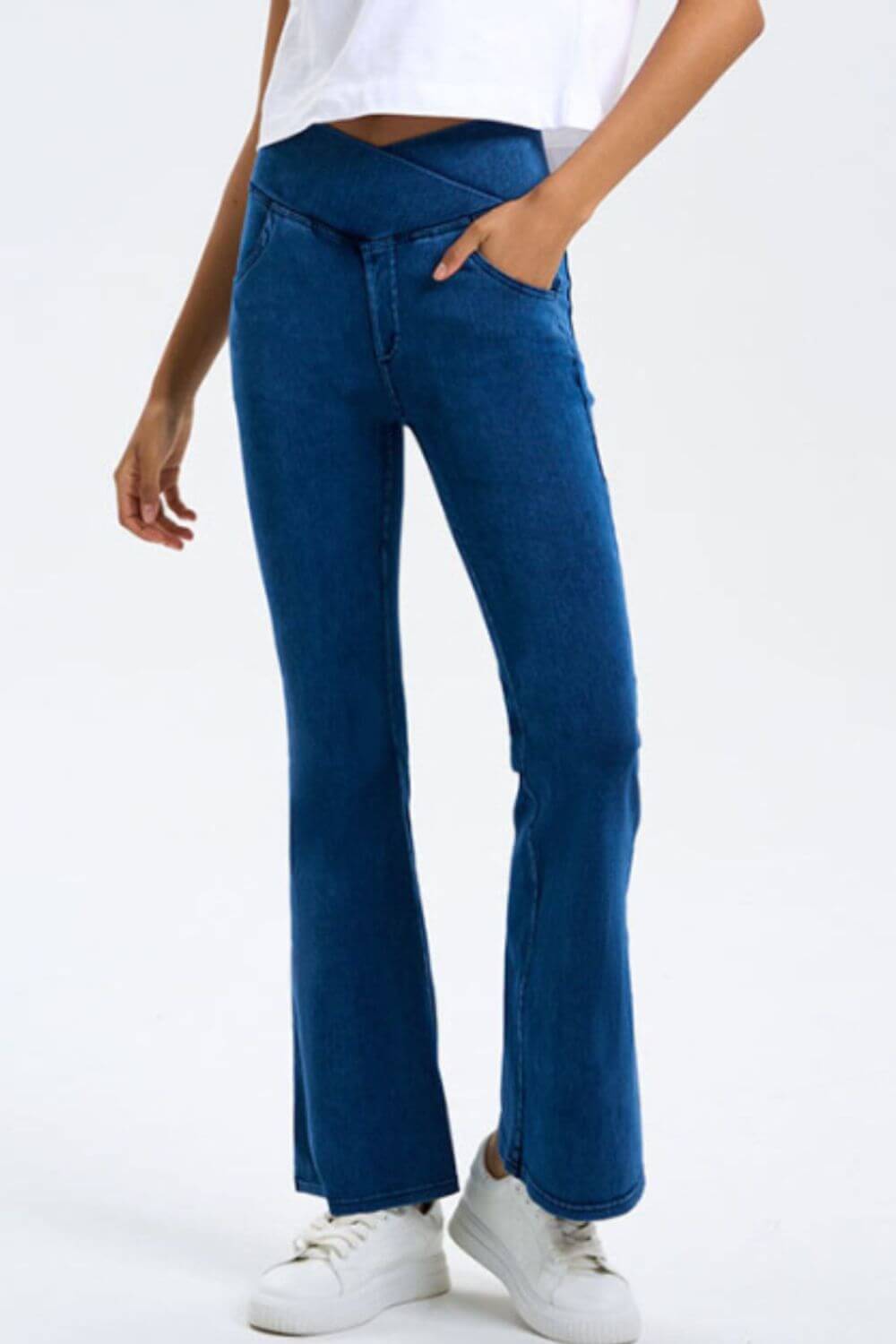 Stylish blue bootcut jeans with pockets and stretchy fit, perfect for a trendy yet comfy look.