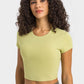 Millennia round neck short sleeve cropped sports t-shirt in light green, perfect for yoga and fitness activities.