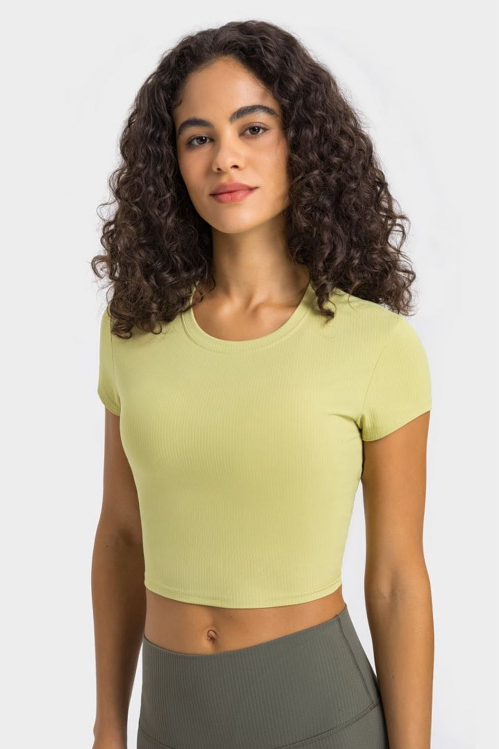 Millennia round neck short sleeve cropped sports t-shirt in light green, perfect for yoga and fitness activities.