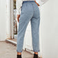 Stylish woman in light blue straight leg jeans with pockets, paired with high-heeled boots, showcasing a trendy back view.