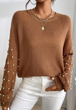 Bella Road pearl detail round neck long sleeve sweater in brown, featuring elegant pearl embellishments on the sleeves.