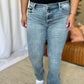 Woman wearing Judy Blue full size medium rise bootcut jeans showcasing comfortable fit and classic style