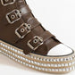 Brown multi-buckle strap studded platform sneakers with a shiny decorative sole for a bold, edgy look.