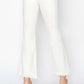 White tummy control crop flare pants with raw step hem and pockets, enhancing silhouette.