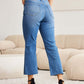 Woman wearing RFM Jeans Mini Mia Full Size Tummy Control High Waist Jeans Petite in living room