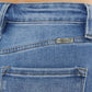 Close-up of Cat's Whiskers High Waist Jeans back pocket detailing and stitching, highlighting vintage charm and high waist design.