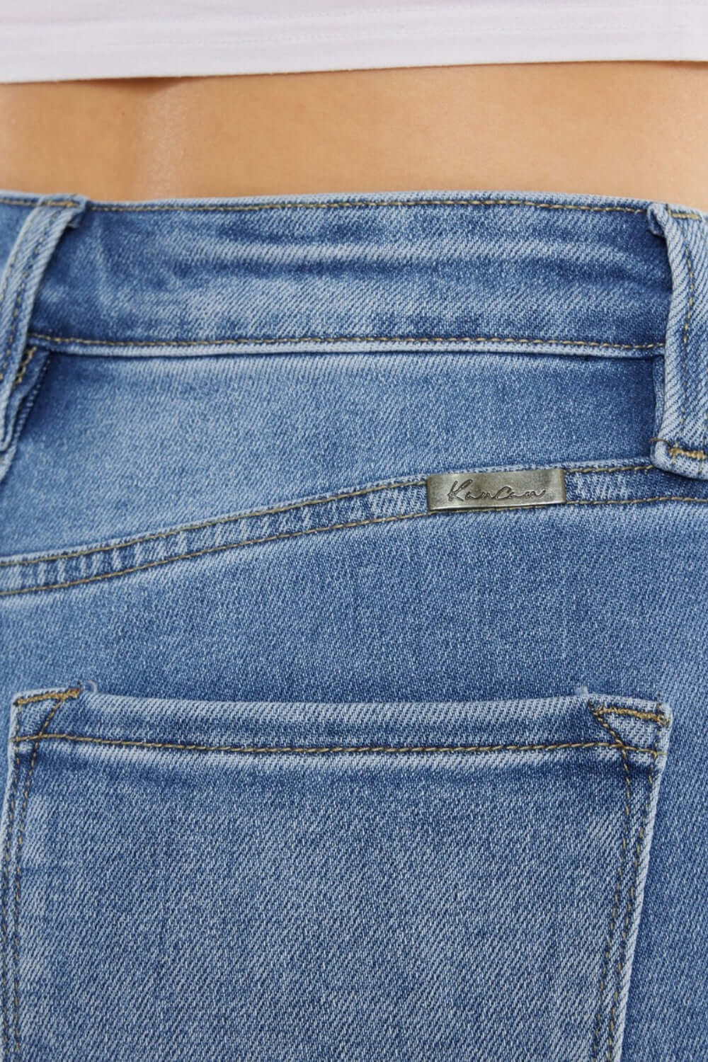 Close-up of Cat's Whiskers High Waist Jeans back pocket detailing and stitching, highlighting vintage charm and high waist design.