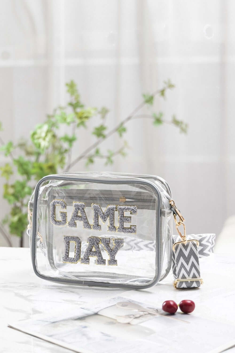 Zenana GAME DAY transparent crossbody bag with glitter trim, perfect for stadiums. Stylish and practical with adjustable strap.