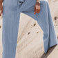 Model showcasing Bella Road Drawstring Wide Leg Jeans in medium blue, highlighting comfort and trendy style on sandy terrain.