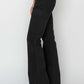 Black high-rise side slit cargo bootcut jeans by Risen Jeans with a flattering high waist and edgy side slits.