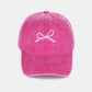 Pink washed cotton cap with white bow embroidery, stylish and feminine, offering a comfortable and breathable fit for all-day wear