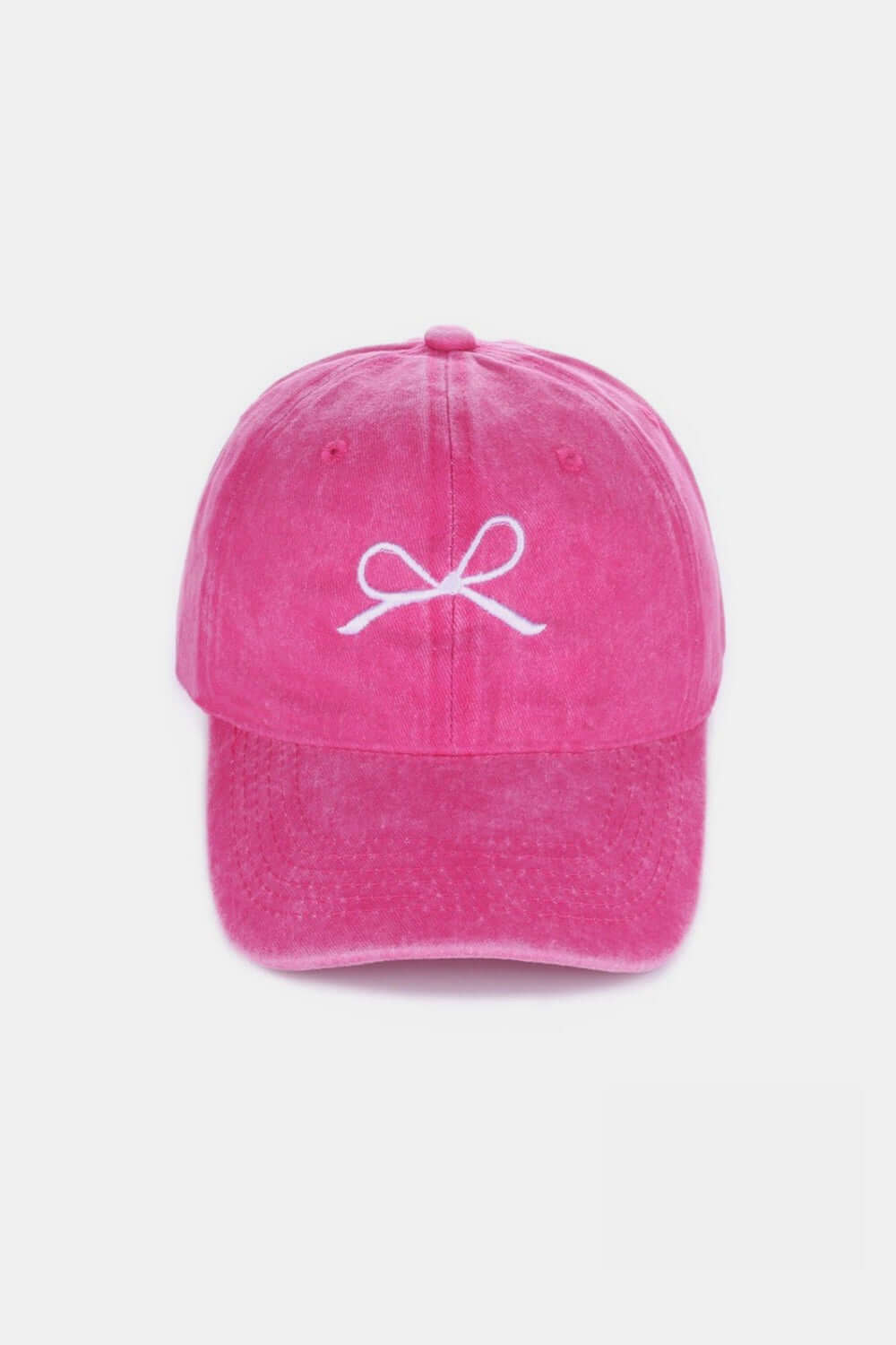 Pink washed cotton cap with white bow embroidery, stylish and feminine, offering a comfortable and breathable fit for all-day wear