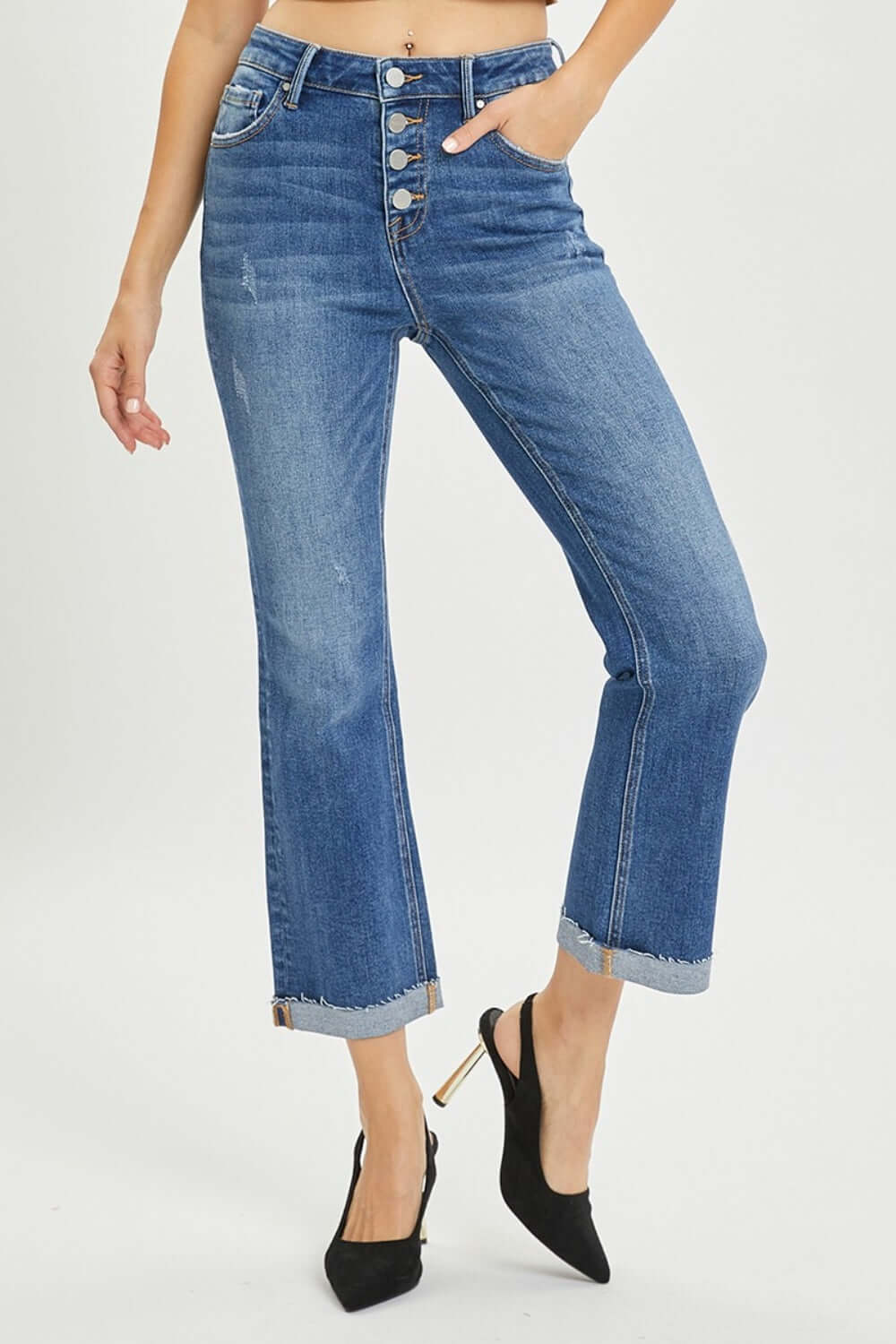 Stylish Risen Button-Fly Cropped Bootcut Jeans showcasing chic button fly closure and cropped length, perfect for flaunting your favorite shoes.