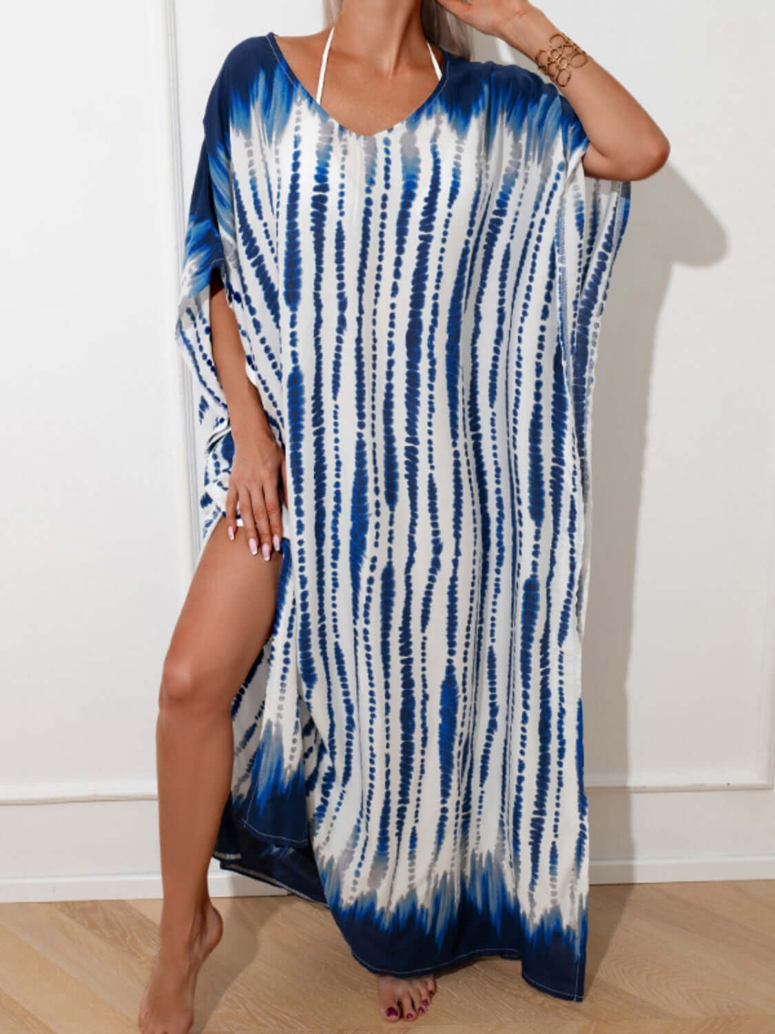 Woman modeling slit tie-dye half sleeve cover up in blue and white, made of 100% cotton with slight stretch, perfect for beach or casual wear.