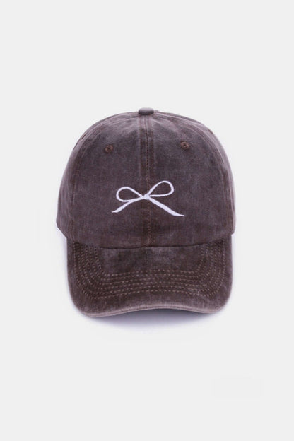 Bow Embroidered Washed Cotton Cap with delicate bow design in brown color for a stylish and comfortable accessory.