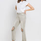 Woman wearing Lovervet Distressed Raw Hem Cropped Flare Jeans styled with white top and heeled sandals