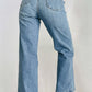 Woman wearing petite straight jeans with pockets and button details, showcasing a stylish back view. Perfect for casual occasions.