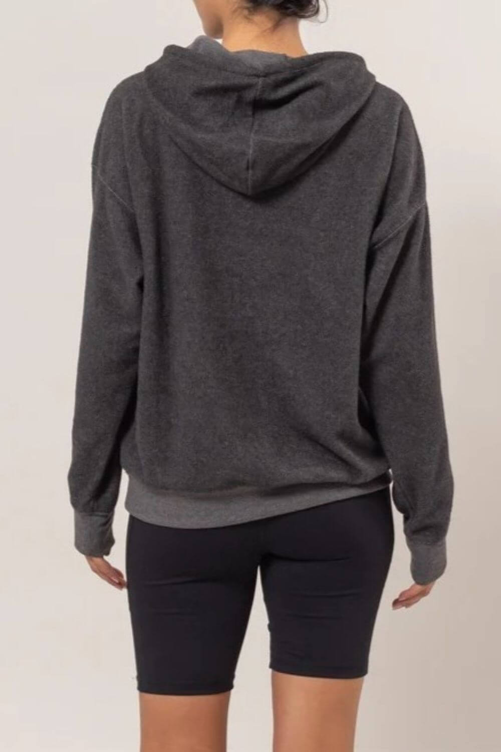 Cozy black brushed hoodie with long sleeves and kangaroo pocket, perfect for casual wear and lounging.