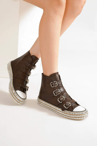 Brown multi-buckle studded platform sneakers showcasing edgy style and trendy flair. Perfect for a punk-inspired look.