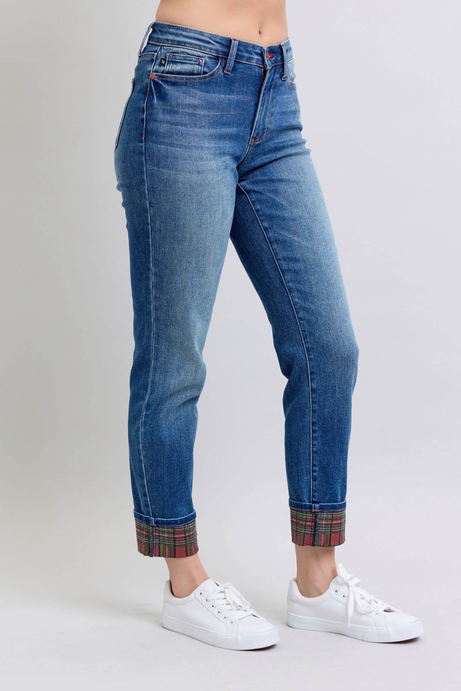 Judy Blue plaid cuff straight leg jeans, mid waist, featuring stylish pockets and a trendy look with white sneakers.