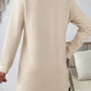 Back view of Bella Road beige textured long sleeve mini dress, featuring a subtle herringbone pattern and a comfortable fit.