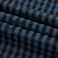 Blue and black plaid fabric close-up of Bella Road wide leg overalls, showcasing stylish and trendy material pattern.